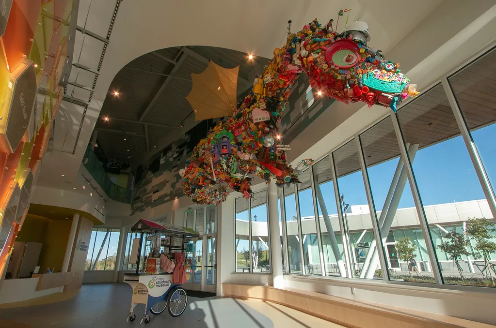 a large sculpture of a dragon in Florida Children's Museum