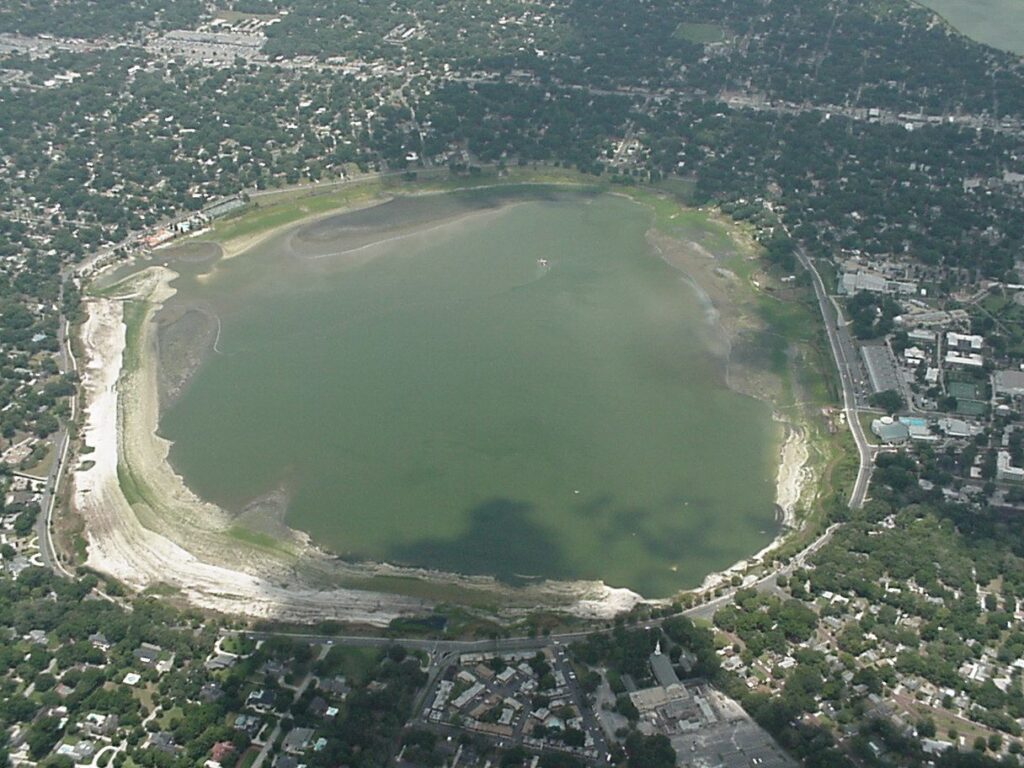 aerial view of a lake surrounded by a city in Lake Hollingsworth