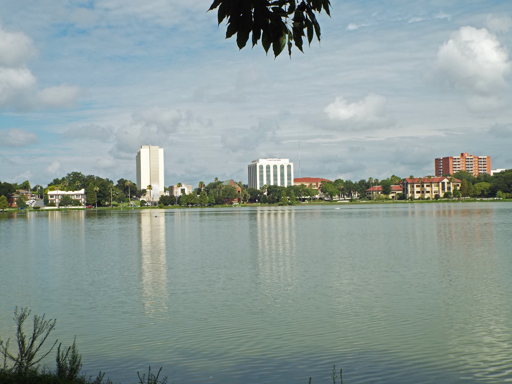 a body of water with buildings in the background in Lake Morton